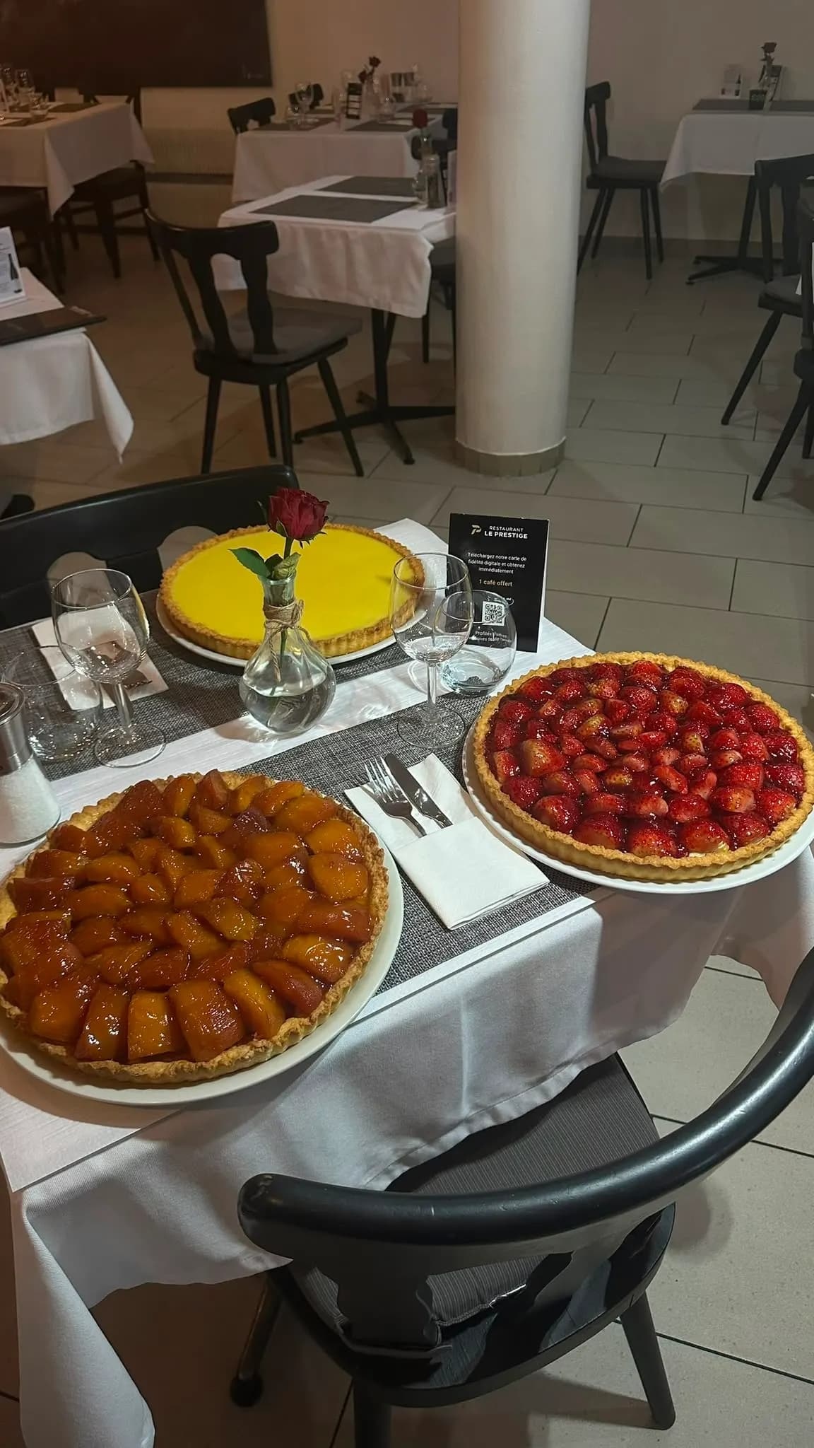 The buffet of tarts and desserts, laid out on a white tablecloth